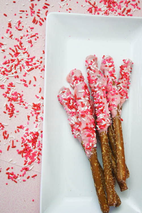 Chocolate dipped pretzels are such a fun Valentine's Day treat. There are so many ways to decorate and the end result is a decadent sweet and salty snack that everyone loves - especially the kiddos.
